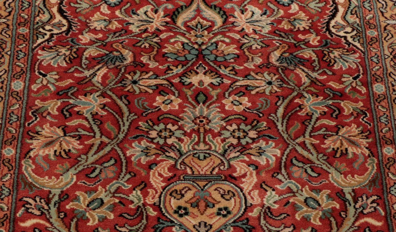 The wondrous floral patterning present throughout the rug can be greatly appreciated when studying this central image.